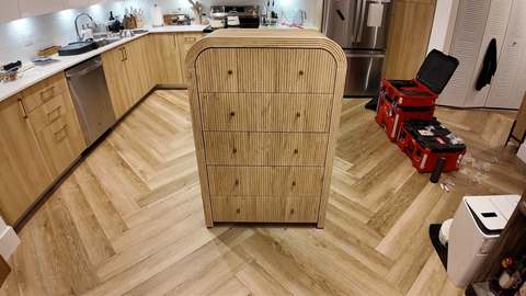 Light-wood dresser assembled with drawers aligned and adjusted